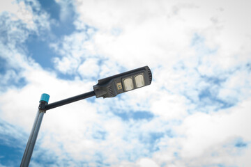 DIY Metal poles on the road with solar panels built in to produce renewable photovoltaic power in...