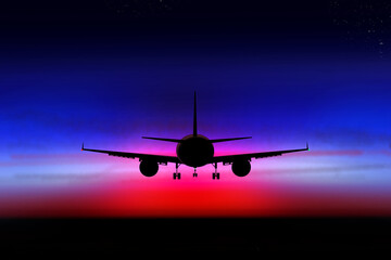 Fototapeta na wymiar Airplane in the dark sky on the background of the sunset