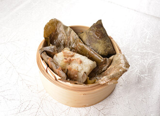 steamed sticky glutinous rice and meat wrapped in lotus leaf bamboo basket hong kong dim sum menu