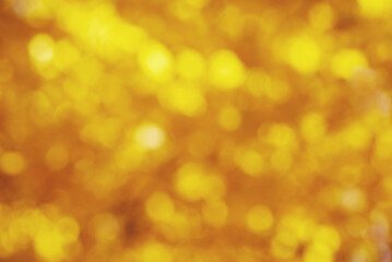 Golden colored blurred background. Abstract background with bokeh.