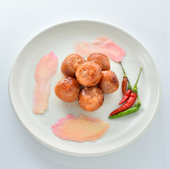 Northeastern Sausage in a white plate on a white background.