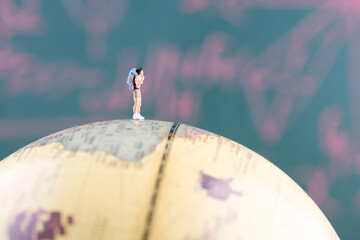Hiker standing on the globe