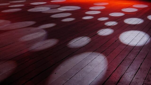 Concert lighting on an empty stage, circles of light on the floor.