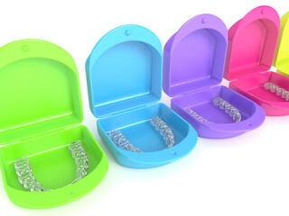 3d render of clear and removable aligners with cases over white background