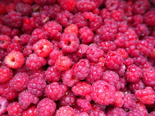 Raspberry background. Large, red, fresh, first-class berries of garden raspberries. Lots of...