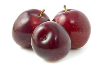 Fresh plums isolated on white background.