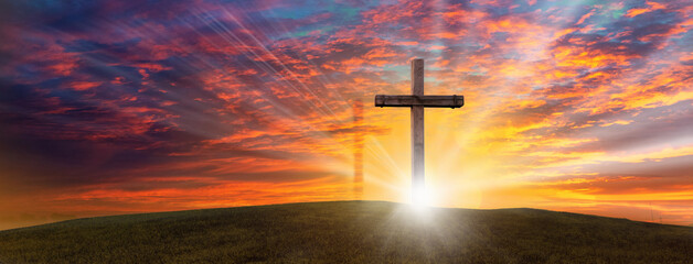 Wood cross of Jesus crucifixion and resurrection with bursting sunray background. Christianity and spiritual concept.