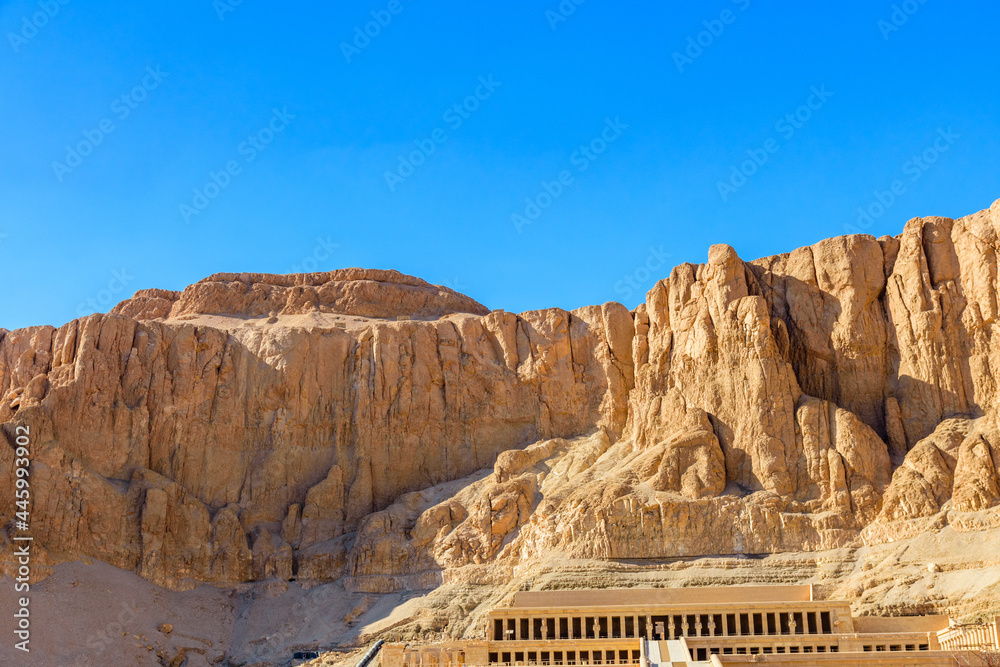 Wall mural View on a temple of Hatshepsut under the high cliffs in Luxor, Egypt