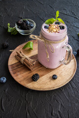 Healthy smoothie of fresh summer berries. Creative atmospheric decoration
