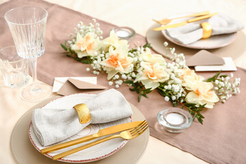 Beautiful table setting with narcissus flowers