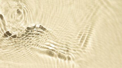 Summer banner background. Yellow liquid colored clear water surface texture with splashes bubbles. Trendy nature background. Transparent clear water.