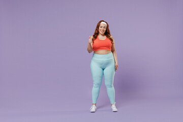 Fototapeta na wymiar Full length young fun chubby overweight plus size big fat fit woman wear red top warm up training show thumb up gesture isolated on purple background studio home gym. Workout sport motivation concept.