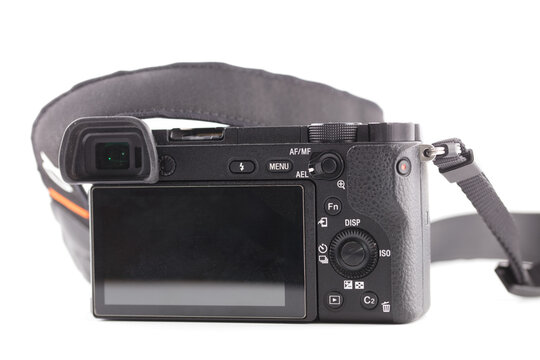 Black mirrorless camera on white background