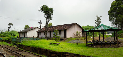Countryside beautiful landscape scenery with rail roads and old rusty buildings. cold and moody weather conditions.