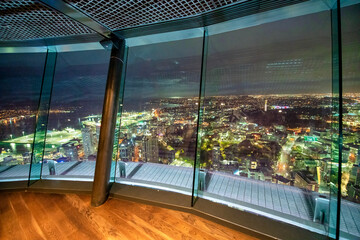 Modern empty and clean office interior with glass windows with night city skyline view