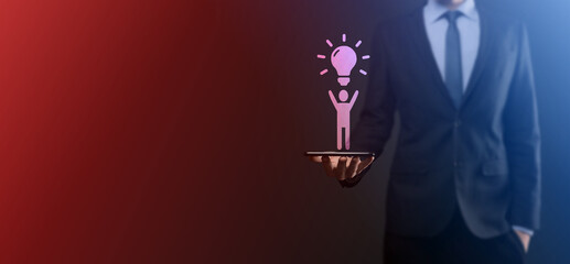 Businessman hold man icon with light bulbs, ideas of new ideas with innovative technology and creativity. concept creativity with bulbs that shine glitter.