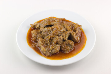 plato tipico de cerdo en salsa, typical spanish dish of pork in sauce