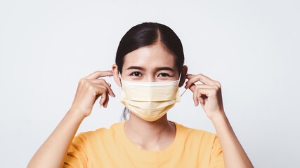 Close up woman face holding face mask for protection from virus.