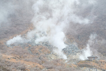 Small house on Kami Mountain with smoky around area in Owakudani Hell Valley , Hakone Boiling steam ,Japan