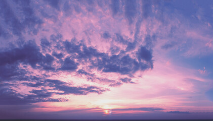 Naklejka na ściany i meble Purple cloudy sky at sunset. Sky texture. Abstract nature background