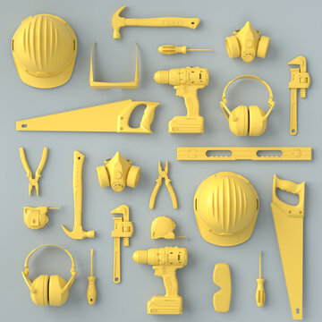Top view of monochrome construction tools for repair on grey and yellow
