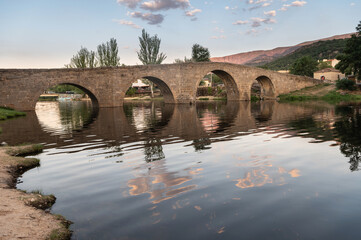 The so-called Old Bridge or Romanesque Bridge crosses the Alberche River as it passes through the...