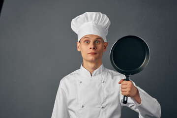 chef with a frying pan in his hands emotions cooking restaurant