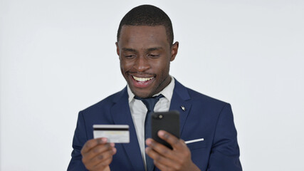 Online Shopping on Smartphone by African Businessman, White Background