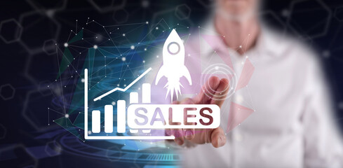 Man touching a sales growth concept