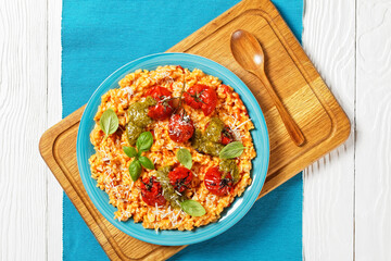 creamy tomato risotto with pesto, top view