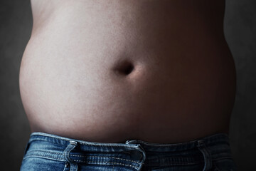 Young man with fat belly