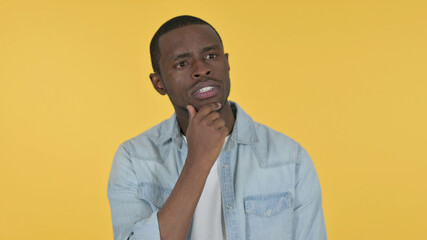 Young African Man Thinking Getting Idea, Yellow Background 