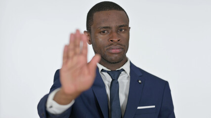 African Businessman with Stop Sign by Hand, White Background
