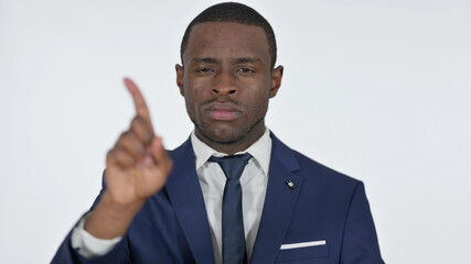No Sign with Finger by African Businessman, White Background