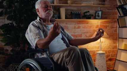 Old man in a wheelchair meditates. Disabled senior man doing yoga - Powered by Adobe
