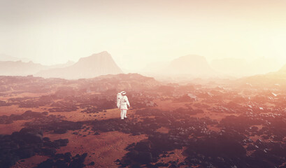 Obraz premium Astronaut doing space walk and explore planet such as Mars.