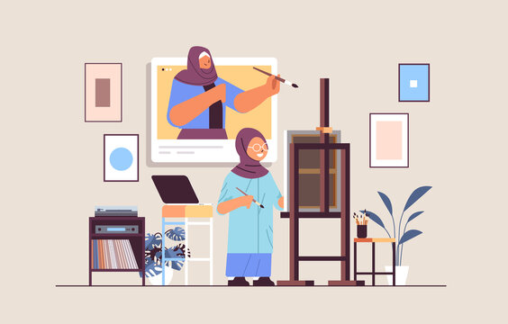 arab schoolgirl with female teacher artist in web browser window painting picture during video call self isolation