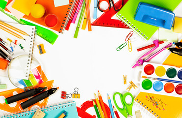 school supplies on a light background are laid out in a circle