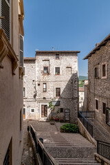 Fototapeta na wymiar The characteristic stone houses in the historic center of Cascia, Italy, a few meters from the Basilica of Santa Rita