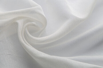 Naklejka na ściany i meble Closeup shot of white swirled fabric