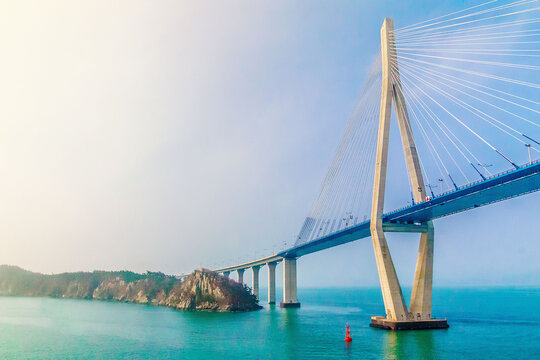 MOKPO, KOREA, SOUTH - Apr 02, 2016: Mokpo Bridge over the sea under the sunlight and a blue sky in South Korea