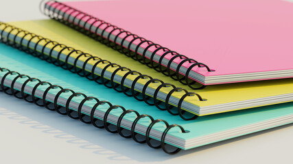 Stacked spiral binder notebooks. Blank colourful notebooks. Closeup side view. 3D rendering illustration.