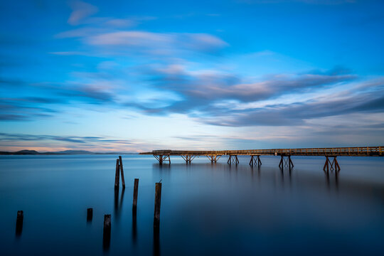 Beautiful shot of a bridge leads to the sea in Sidney Pier, Sidney, Vancouver Island, BC Canada