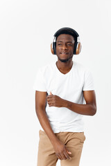 Cheerful man in headphones listening to music entertainment technology isolated background