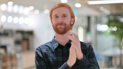 Naklejka premium Portrait of Redhead Man Applauding, Clapping 
