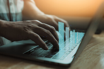 Businessman use laptop, analytics and financial and bank technology concept, chart from computer...