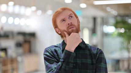 Portrait of Pensive Redhead Man Brainstorming New Plan