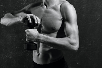 Fototapeta na wymiar man with a pumped-up torso in gloves workout exercises muscles
