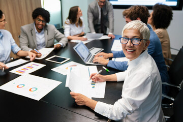 Group of multiethnic business people working at busy modern office