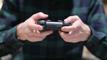 Close up of Hands Playing on Video Game Controller 